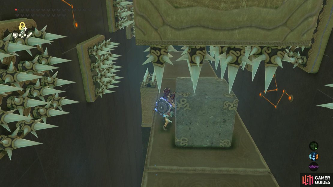 Wait for the side pillars to retract, then go around the side of the cube.