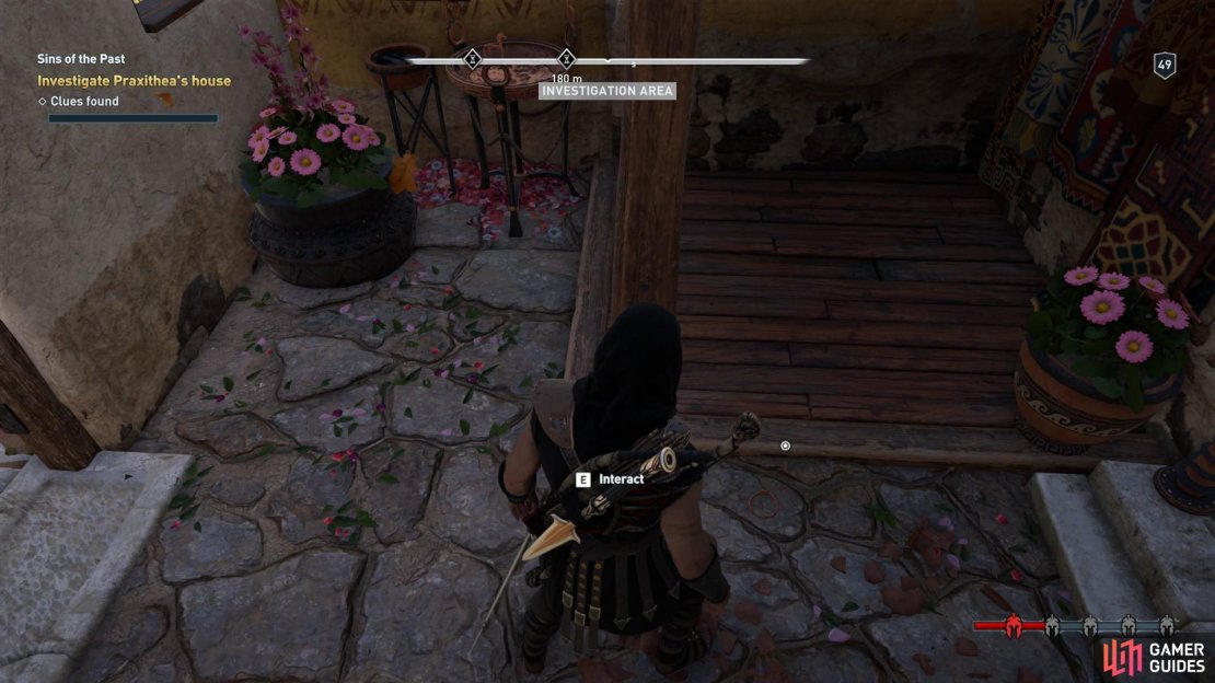 Inspect the bracelet on the floor inside the house.