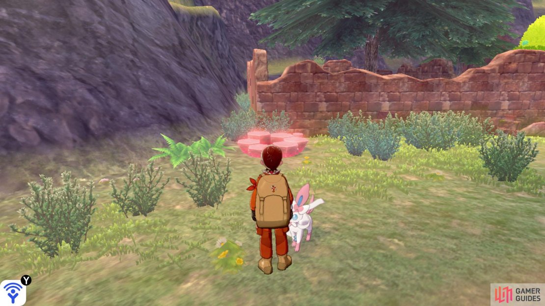 Once you&rsquo;ve through the really, really long stretch of tall grass, this den&rsquo;s on the left, next to a worn down brick wall.