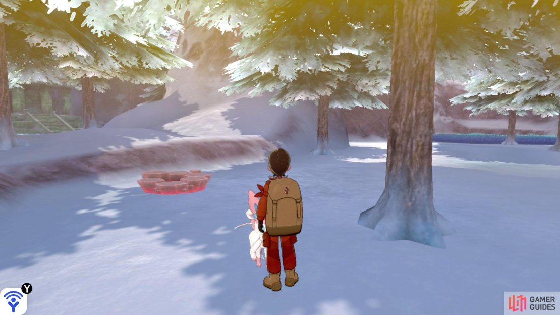 To the right of the previous den, not far from the archway that leads to the Iceberg Ruins. It&rsquo;s aligned with a row of trees.