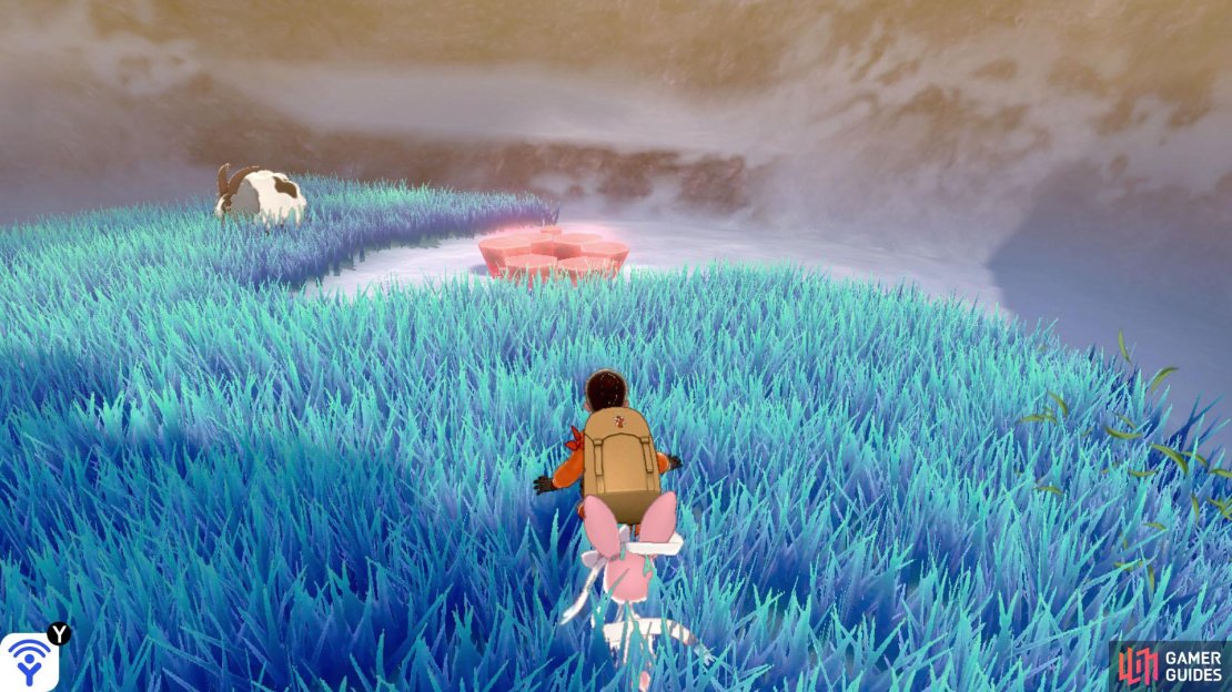 To the right of Den D. Right before the archway, there&rsquo;s some tall grass on its right. This den is located through the grass.