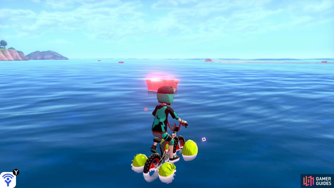 Opposite the Tower of Waters, past the exclamation mark islands, there&rsquo;s an islet with a boulder. Further ahead, there&rsquo;s a string of three Pok&eacute;mon Dens, going towards the direction of Loop Lagoon. This den is the first one, closest to the Tower of Waters.