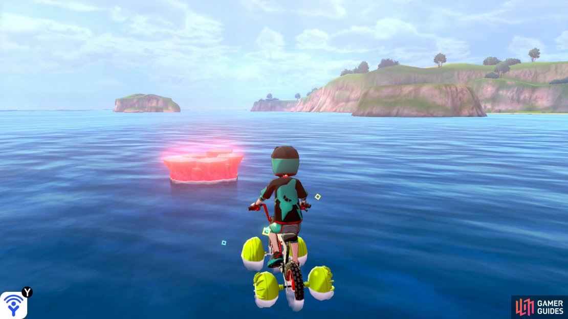 From Den D, turn so the mainland is on your right. Swim to the islet with a boulder, then gaze ahead in the distance. There should be a den that&rsquo;s between two rocky islands. Swim towards that den. Alternatively, if you return to the first islet, opposite Armor Station, it&rsquo;s in the middle of the sea if you look slightly to the right.