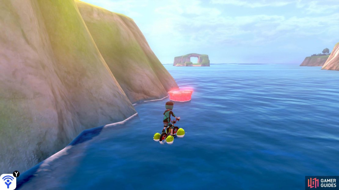 From Den E, swim over to the rocky island that&rsquo;s closest to the mainland; it should also be the one nearest to you. This den is found behind the rocky island, on the mainland side. You can also come here from the shore opposite Armor Station. Swim forward with the mainland on your right.