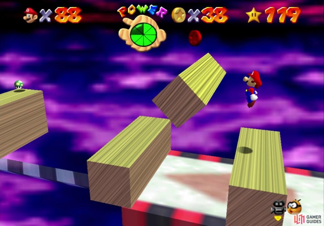 The fifth coin is above the first set of wooden blocks