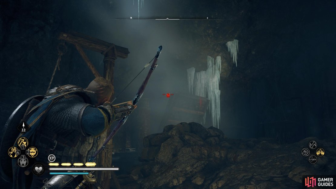 Shoot the links on the bridge to lower it.