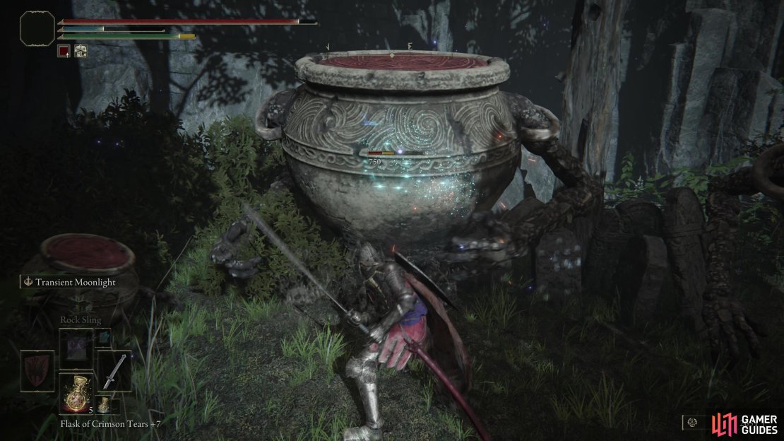 Warrior Jars, both large and small, rest amid the cliffside cemetery.