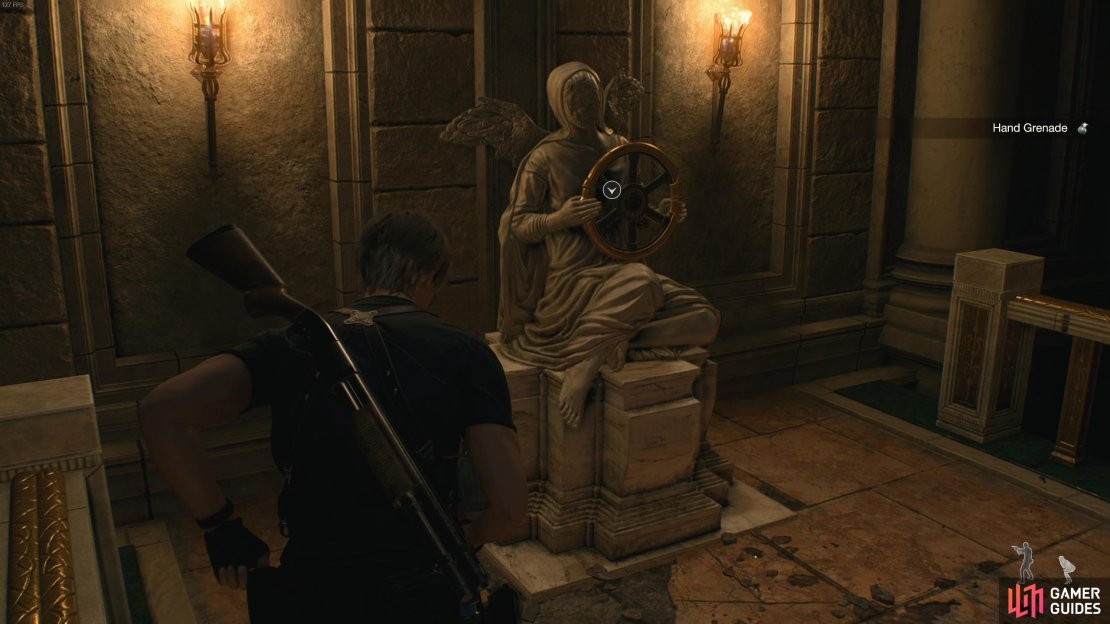 Take the halo wheel from the statue on the level below.