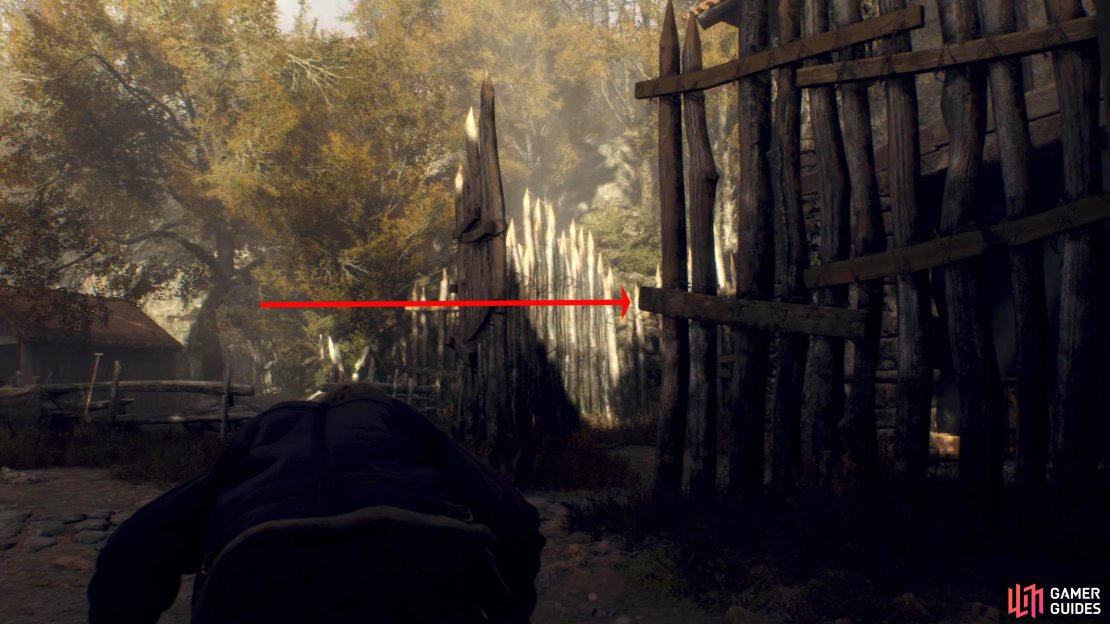 Sneak through the farm until you reach a large wooden fence.