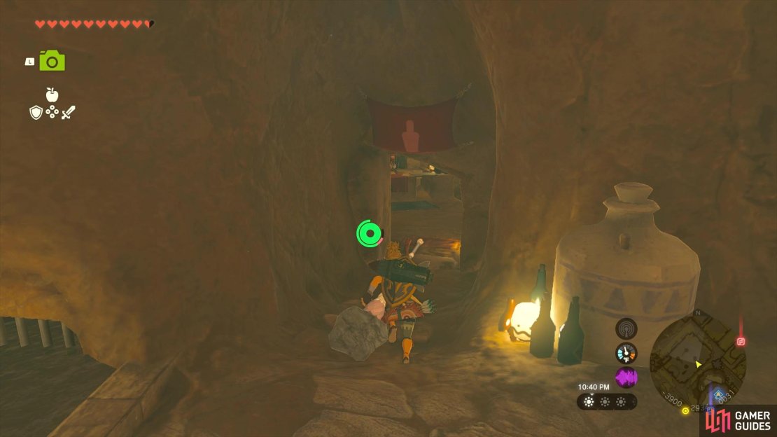 Head through this doorway next to the jail