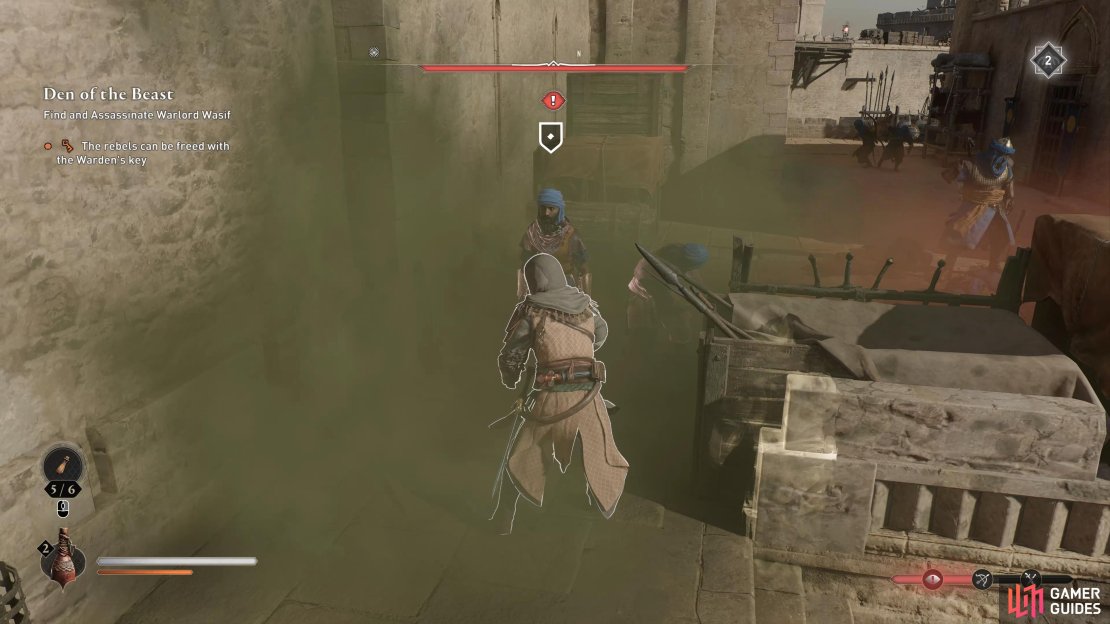 Find the warden with the key and use a smoke bomb to take out the guards.