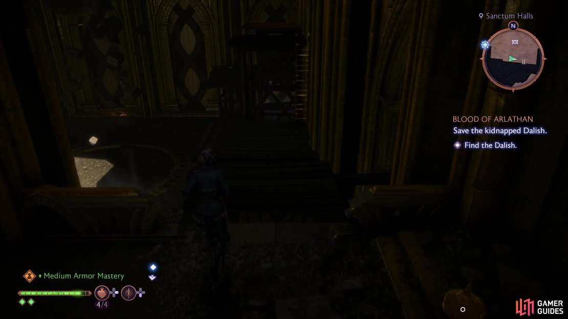 Go up some stairs to the south and cross some wooden platforms,