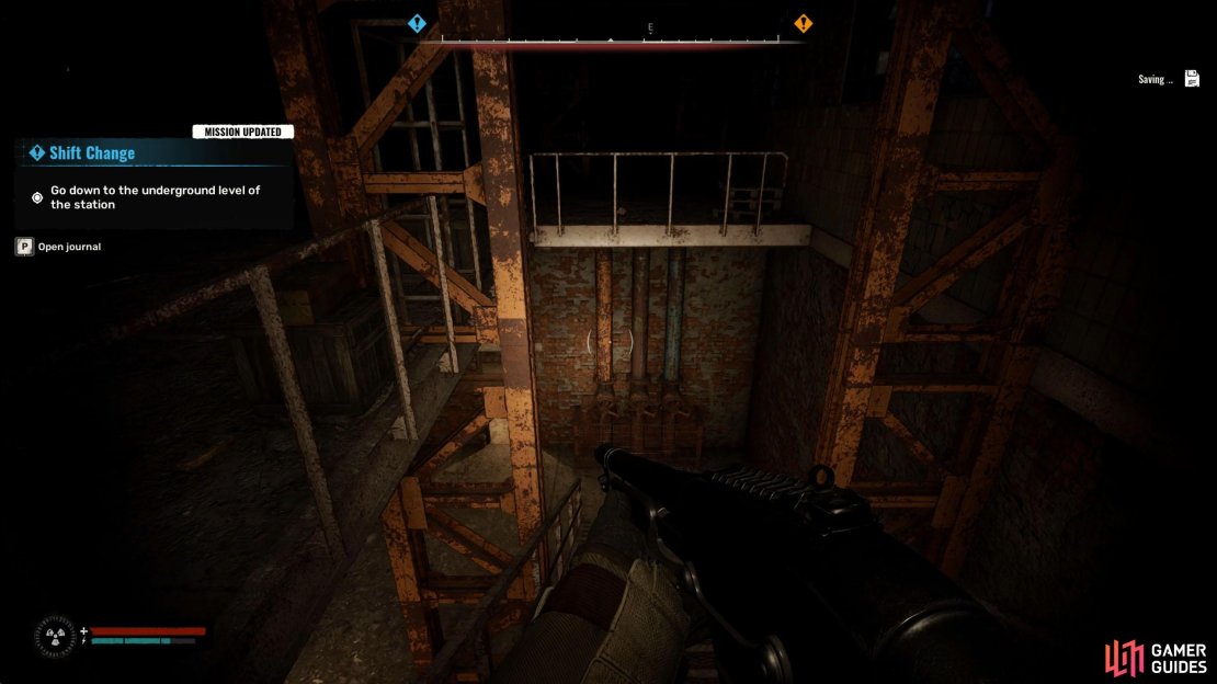Enter the main building and take the nearby stairs down.