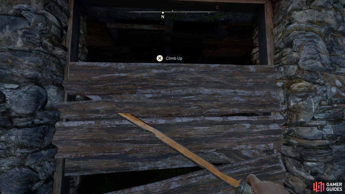 Climb over the boards to get inside the building opposite.