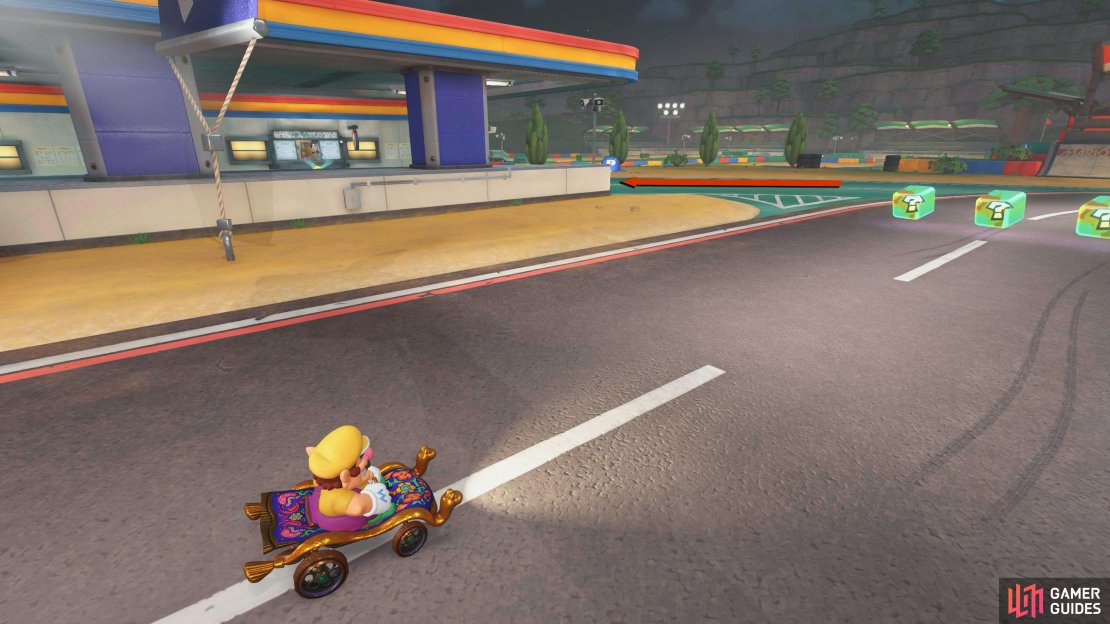 From the starting flag, take the green road to your left onto the main road and then take a right.
