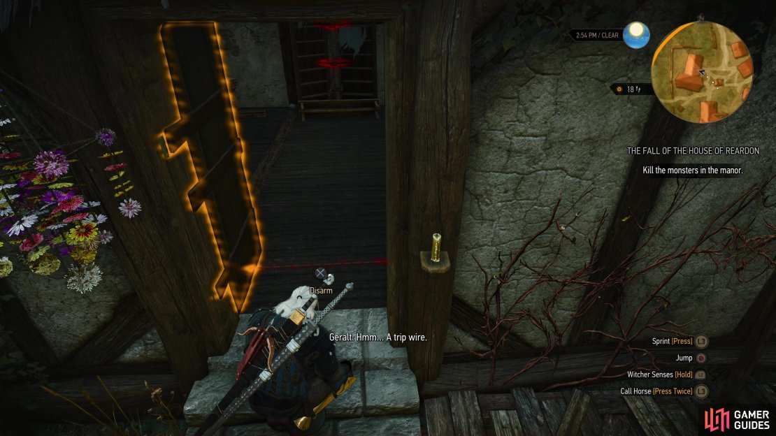 Disarm a tripwire in the doorway, which is rigged to two crossbows,