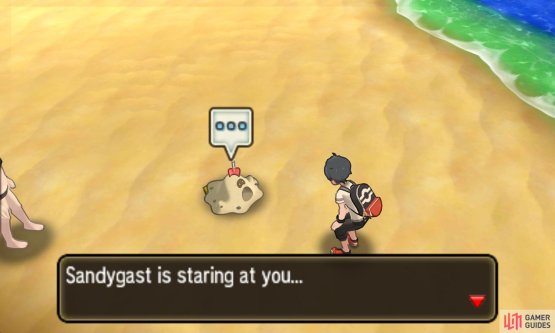It might help to face away from Sandygast while trying to grab the sticker, in case you accidentally interact with Sandygast instead.