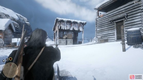 then shoot the crates to force him to the outhouse to the left.