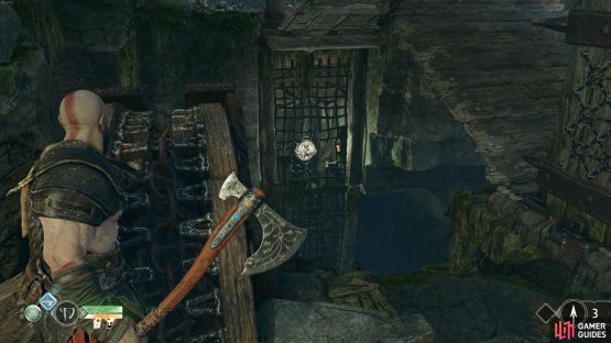 Throw the axe at the symbol when it&rsquo;s revealed through the gap to lower the bridge.