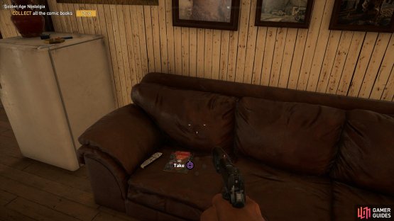 the comic sits on the sofa in the house.