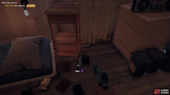 the Lighter is by the bed on the floor.
