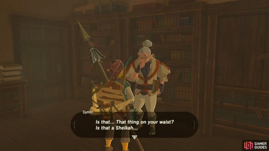 Symin is perusing the books in the back of the room.