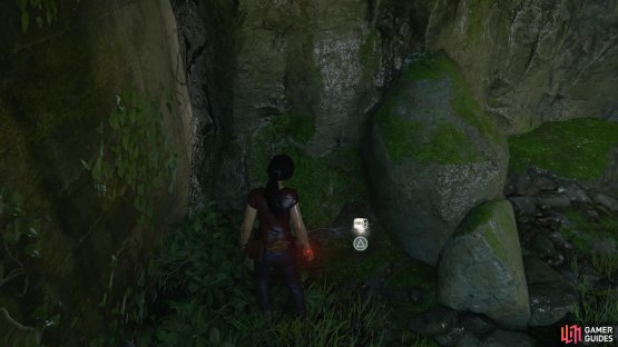 Find the treasure behind a rock at the back