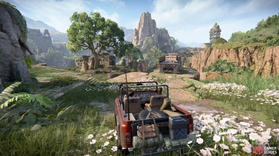 Find the truck parked by the stone elephant statue
