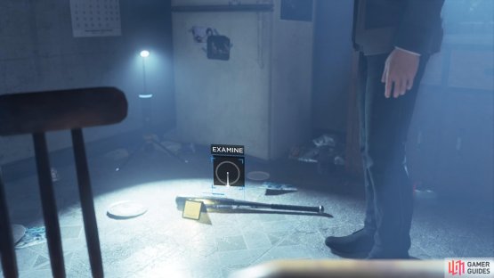 Examine the bat on the kitchen floor