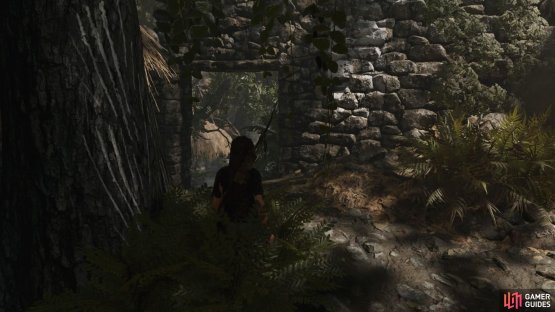 Head left of the village entrance to find the white painted wall