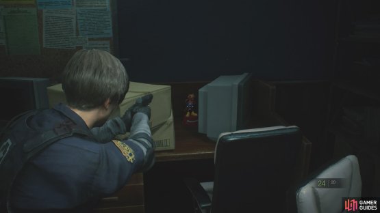 the Raccoon can be found hiding behind some boxes in the southeast corner of the S.T.A.R.S Office.