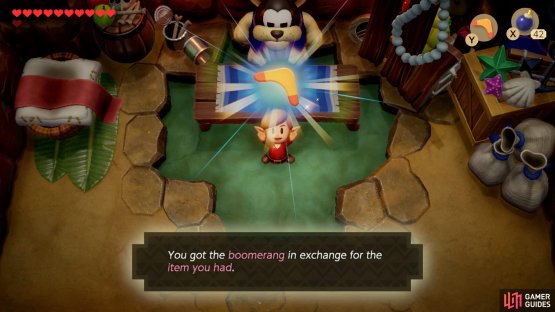then follow the beach around and break a hole into the crumbling wall to speak with Goriya to trade something for a Boomerang.