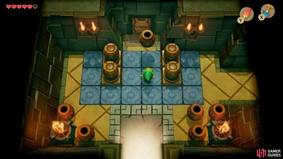 Enter the Key Cavern and pick up a Vase and launch it at the door to get past,