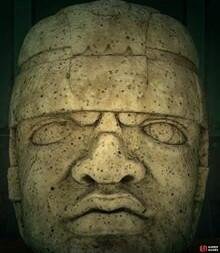 The real sculpture has a straight face