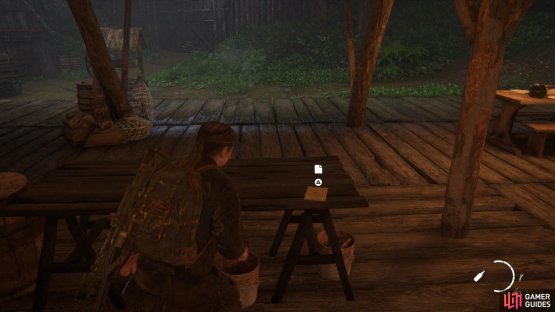 Go inside the first hut to find an Artefact on the table 
