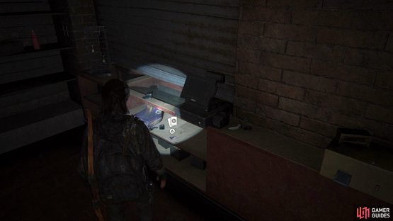 Open the shutter to find a Trading Card under the counter