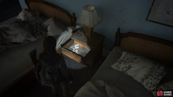 then turn around and open the drawer by the bed to acquire a Trading Card. 