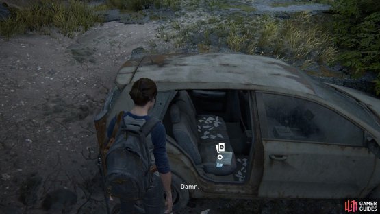 Once you reach the road with Joel, head left to find this Trading Card sitting inside the car in the water 