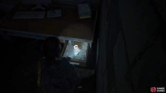 Go into the room on the right to find a Trading Card in a drawer