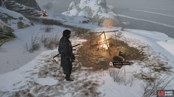 then go around the back to find this Artefact sitting by the campfire.