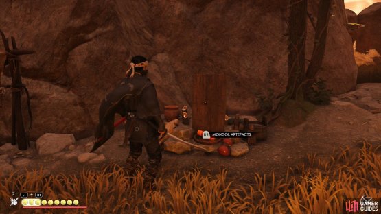 then go over to the large campfire to find this Artefact. 