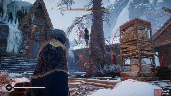 Move the pillar to take the key from the hanged man, then use it to open the chest in the house.