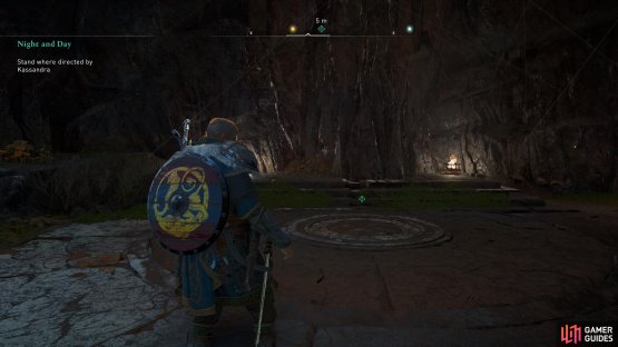 Stand in the centre of the circle near the entrance to the Cave of Gold.