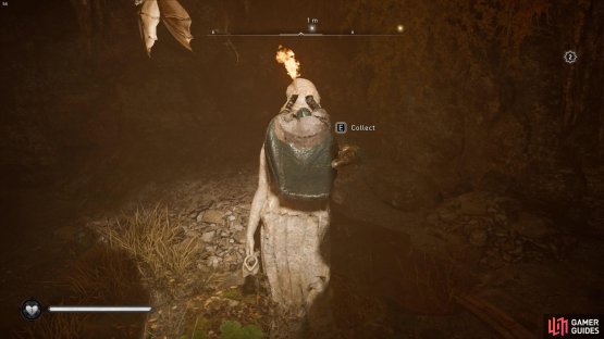 you’ll need to head underground and climb the statue to grab the artifact.