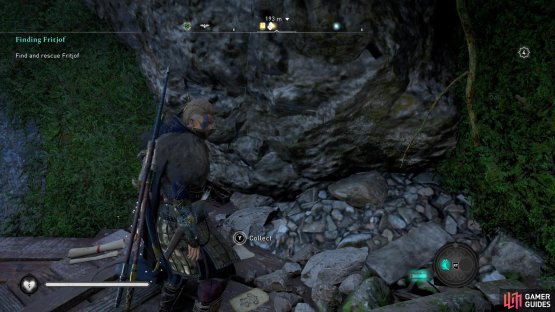 on a wooden platform in a cave to the right of a lava river.