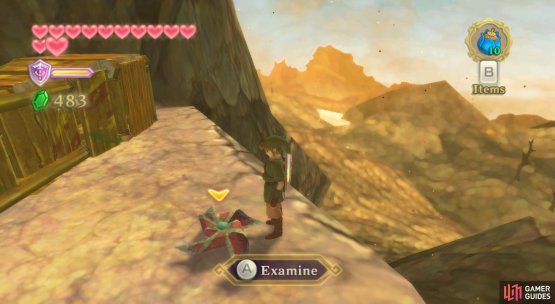 The fallen pinwheel is near the cliff edge.