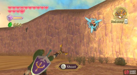 Head through the cavern, then use your Clawshots to traverse the quicksand.