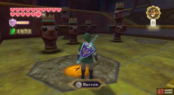 Before burrowing, identify the number of wings on the four statues.
