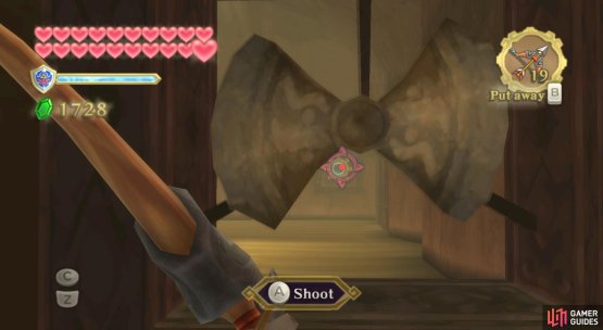 While the fan is in the present era, stand on the floor switch and shoot an arrow through it to the switch on the opposite side.