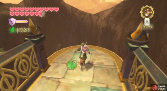 Dive off this ledge, then try and get behind the stalagmite in front.